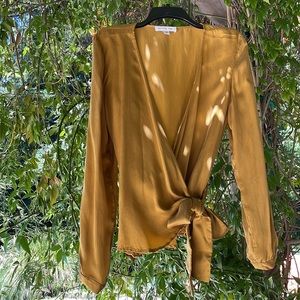 Burnished gold wrap going out out top.